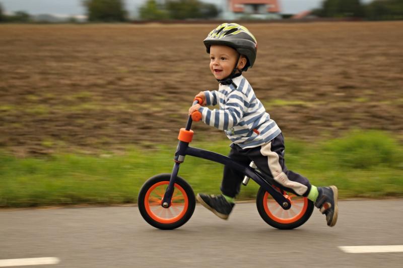 child on a balance bike