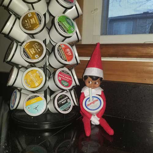 elf on the shelf drinking coffee